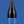 Laden Sie das Bild in den Galerie-Viewer, Eine Flasche Vinosaurier blau vor einem blauen Hintergrund. Die Färbung der Flasche ist aufgrund der dunklen Farbe des Rotweins nicht zu kennen. Der Verschluss ist dunkelrot, das Etikett ist blau. 
